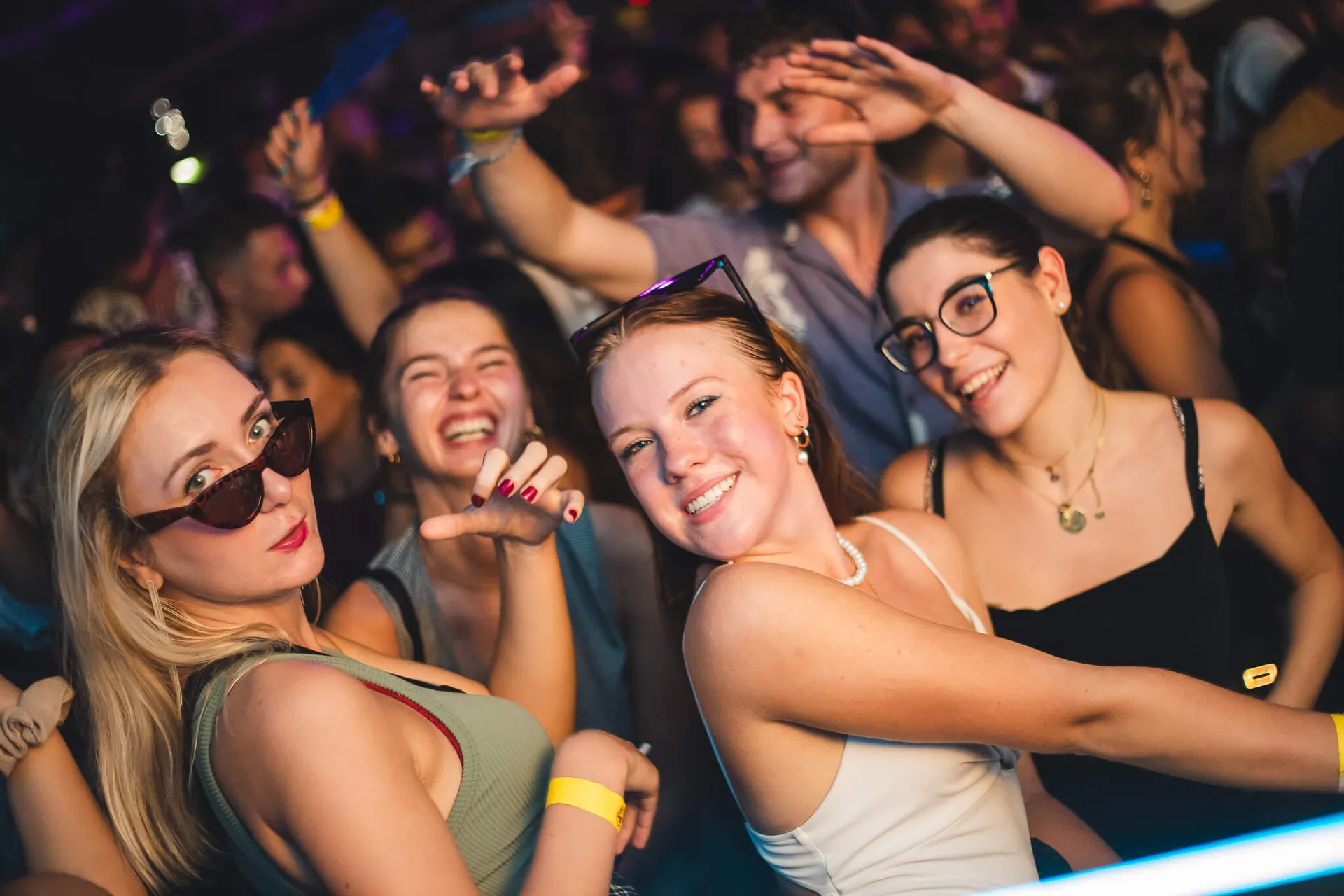 Friends laughing and dancing in the crowd at Move it! Malta